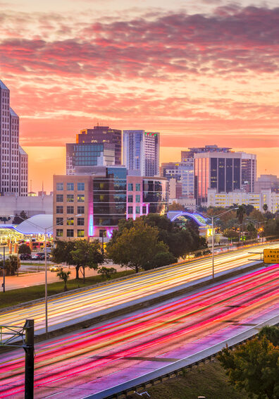 Orlando, Florida, USA downtown cityscape over the highway.